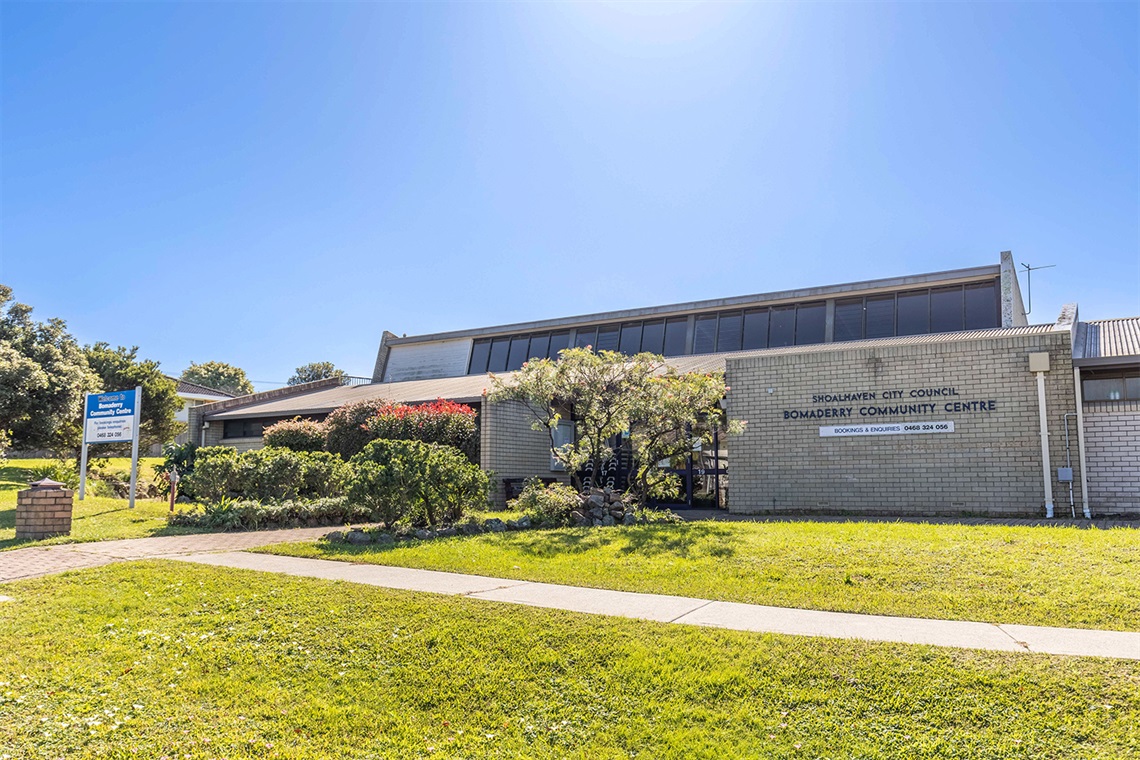 Street view of the front of Bomaderry Community Centre with gardens in the foreground.