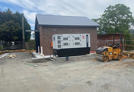 A photo of the Illaroo road pumping station with construction equipment in front of it.