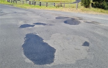 Newly filled potholes and patches on Bryce's Road.