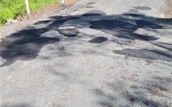 Filling potholes on Irvines Road