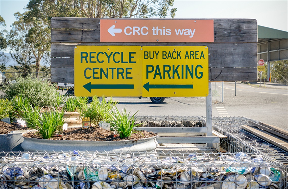 Entrance signage pointing to community recycle centre and buy back area at West Nowra Recycling and Waste Depot