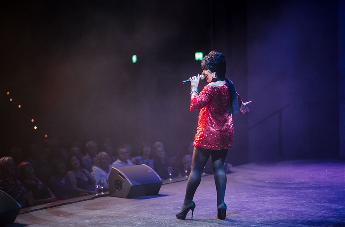 Monique Montez performing onstage at the Shoalhaven Entertainment Centre