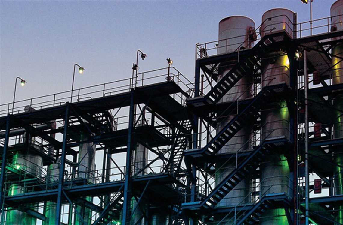 Ethanol chimney stacks surrounded by various platforms and stairs at Shoalhaven Starches in Bomaderry