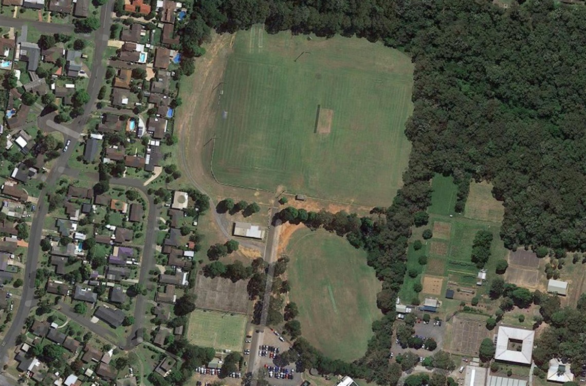 Aerial view of multiple sporting fields among suburban streets