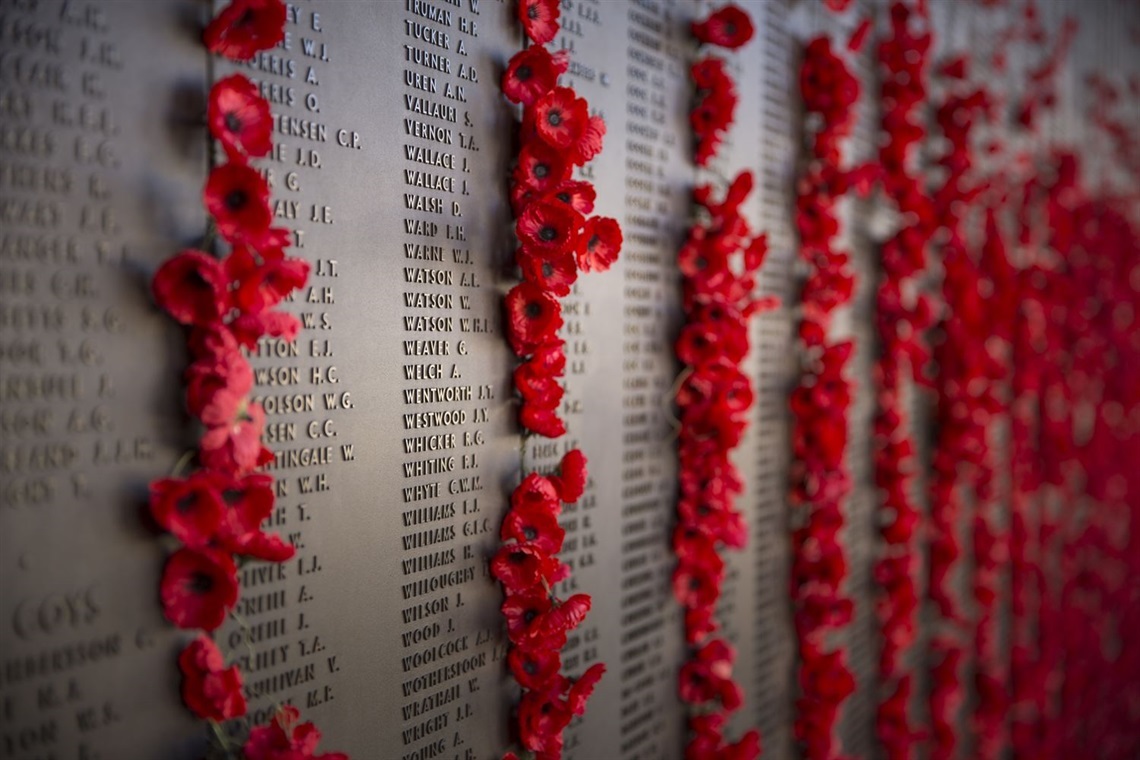 anzac wall, showing the columns of red poppies in-between each panel of anzac veteran names